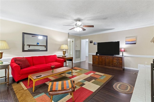 living area featuring hardwood / wood-style floors, a ceiling fan, crown molding, a textured ceiling, and baseboards