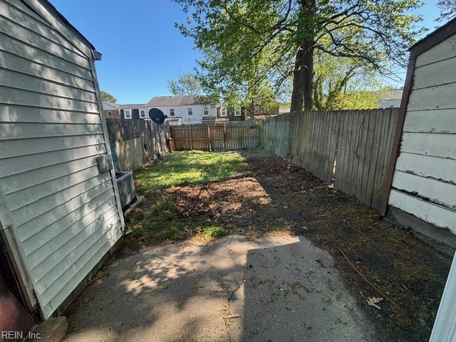 fenced backyard with a patio