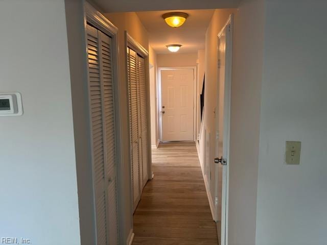 corridor with wood finished floors
