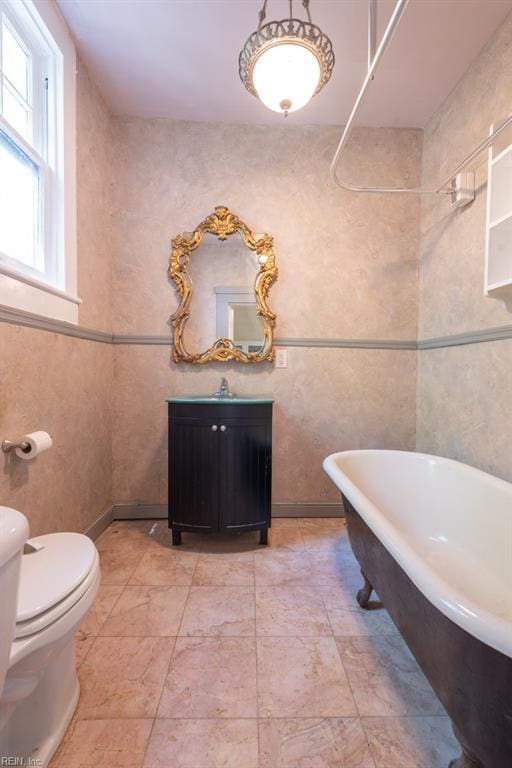 105 Brewer Ave, Suffolk, VA 23434 - bathroom featuring toilet, a freestanding tub, and vanity