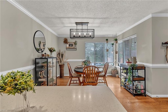 3032 Cape Henry Ct, Virginia Beach, VA 23451 - dining area with a textured ceiling, light wood-type flooring, ornamental molding, a chandelier, and baseboards