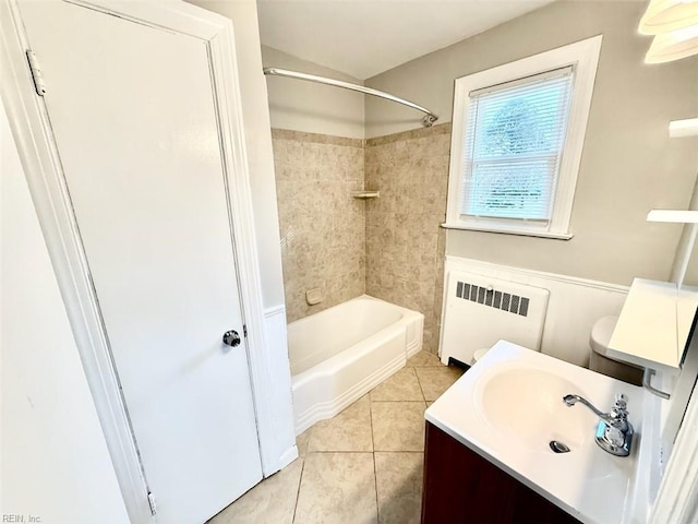 3900 Gosnold Ave, Norfolk, VA 23508 - bathroom with radiator heating unit, tile patterned floors, vanity, and tub / shower combination