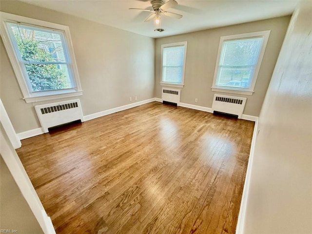 3900 Gosnold Ave, Norfolk, VA 23508 - empty room with radiator heating unit, wood finished floors, and a ceiling fan