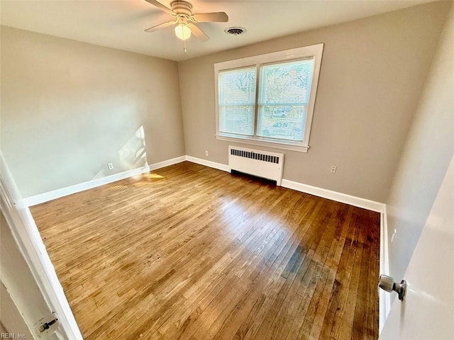 3900 Gosnold Ave, Norfolk, VA 23508 - spare room featuring radiator heating unit, wood-type flooring, ceiling fan, and baseboards