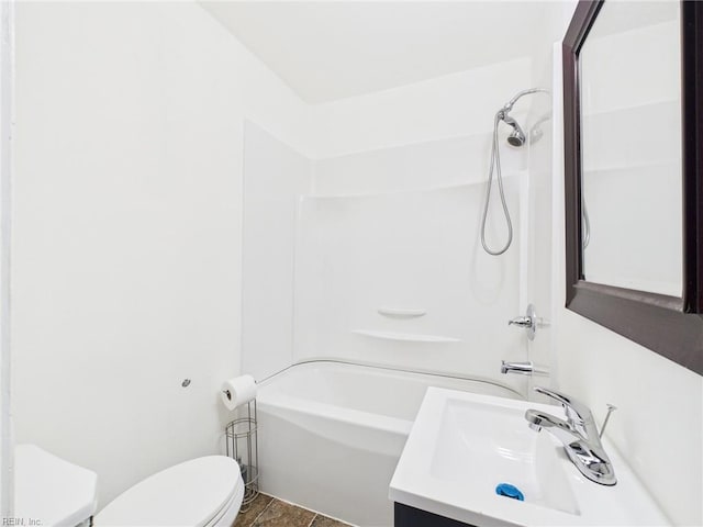 bathroom with toilet, vanity, and bathtub / shower combination