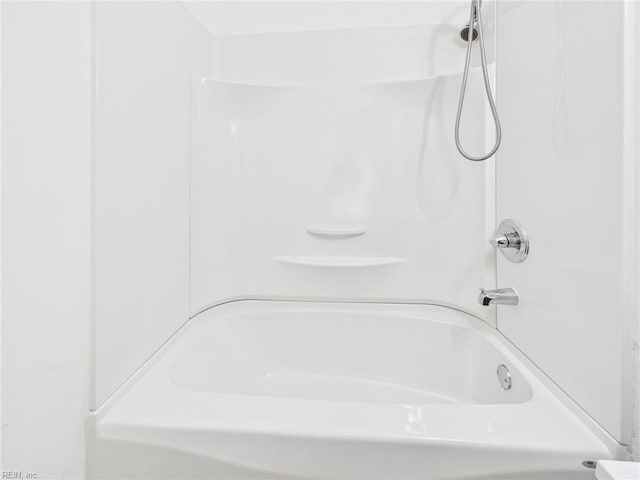 bathroom with shower / tub combination