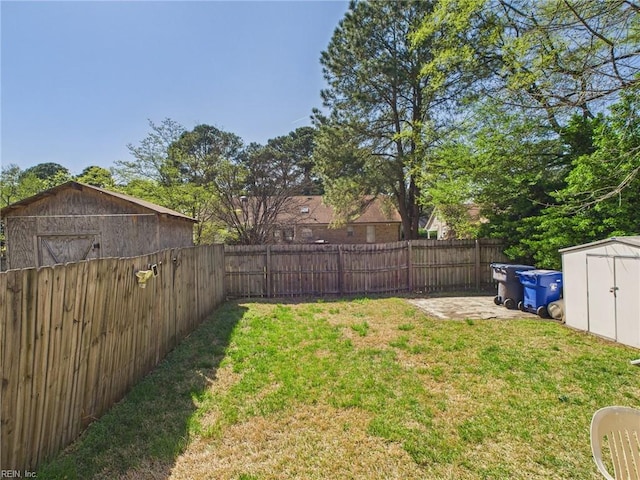 view of yard with a storage unit and an outbuilding
