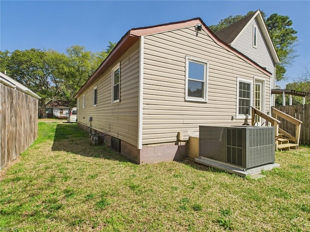 rear view of property featuring central air condition unit