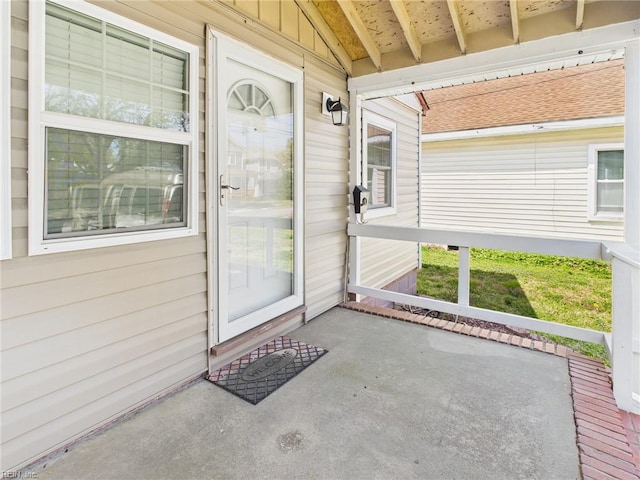 property entrance with covered porch