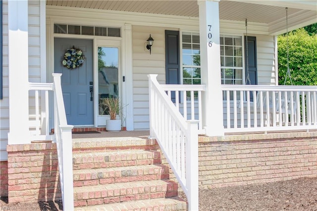 doorway to property with covered porch