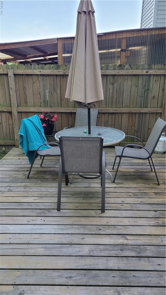 wooden deck with outdoor dining area