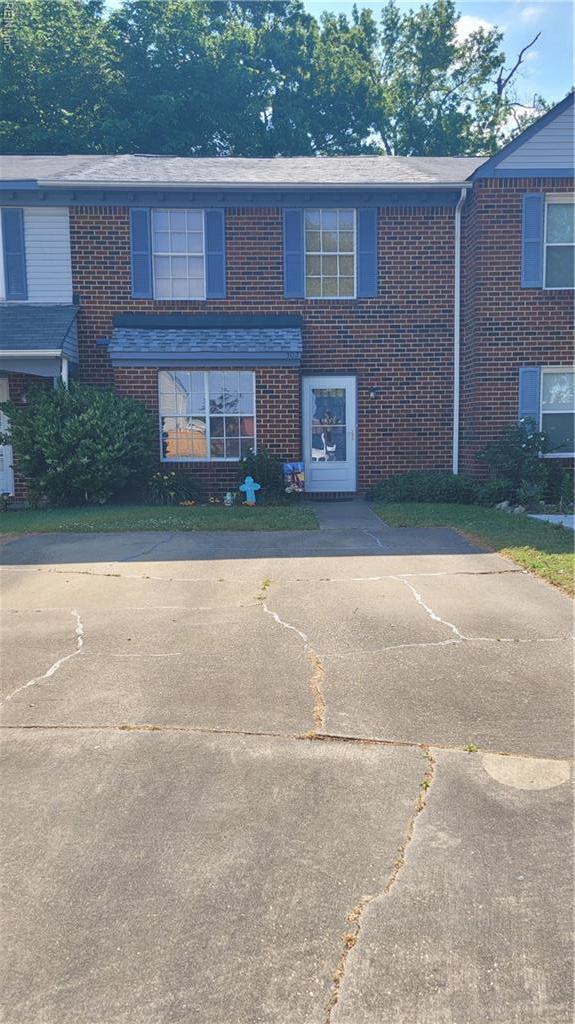 view of front of home featuring brick siding