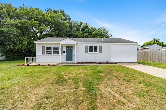 view of front of property with driveway and brick siding