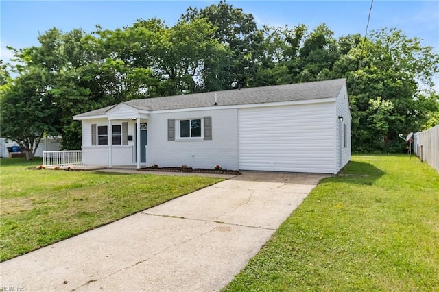 view of front of property with driveway, a porch, brick siding, and a shingled roof