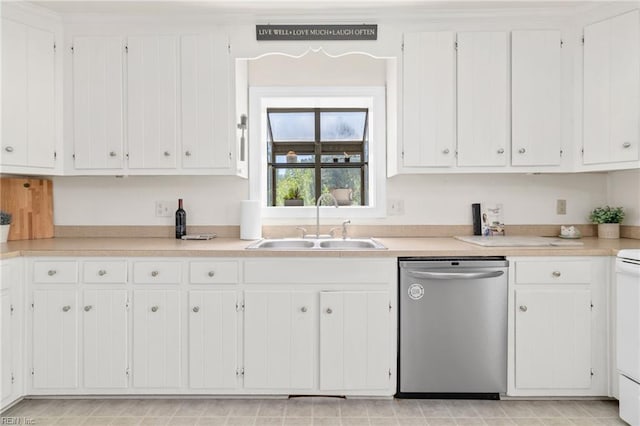 kitchen featuring dishwasher, a sink, white cabinetry, and light countertops