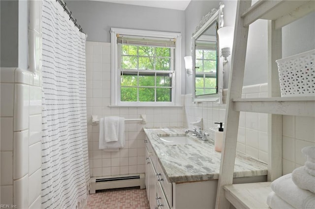 bathroom featuring a baseboard heating unit, tile walls, vanity, and a shower with curtain