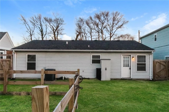 rear view of property with central AC unit