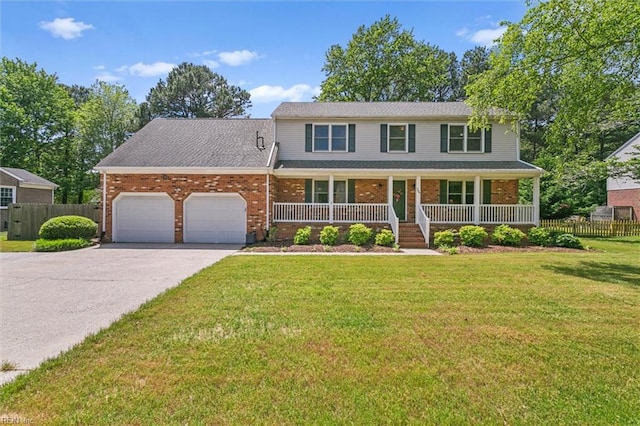 16 Windy Point Dr, Poquoson, VA 23662 - traditional-style home with brick siding, a garage, covered porch, and asphalt driveway