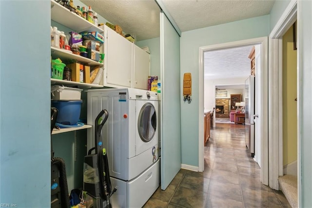 16 Windy Point Dr, Poquoson, VA 23662 - laundry area with washer / clothes dryer, cabinet space, a textured ceiling, and baseboards
