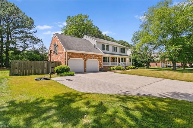 16 Windy Point Dr, Poquoson, VA 23662 - traditional-style home with a porch, a garage, brick siding, and driveway