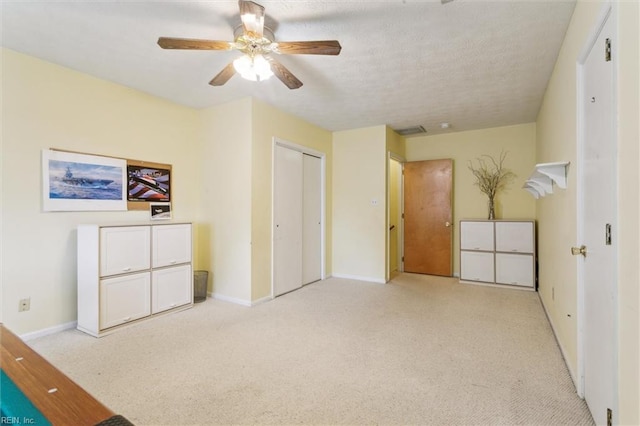 16 Windy Point Dr, Poquoson, VA 23662 - unfurnished bedroom featuring light colored carpet, baseboards, a ceiling fan, and a closet