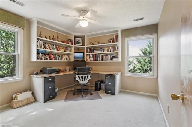 16 Windy Point Dr, Poquoson, VA 23662 - office with plenty of natural light, built in study area, light colored carpet, a textured ceiling, and ceiling fan