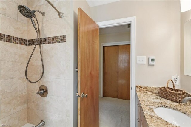 16 Windy Point Dr, Poquoson, VA 23662 - bathroom featuring a tile shower and vanity