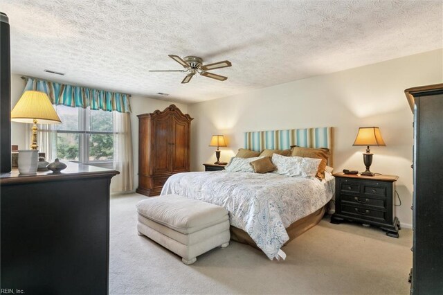 16 Windy Point Dr, Poquoson, VA 23662 - bedroom featuring carpet floors, a textured ceiling, and a ceiling fan
