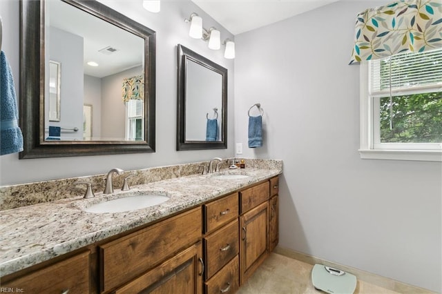 16 Windy Point Dr, Poquoson, VA 23662 - bathroom featuring baseboards, double vanity, and tile patterned floors