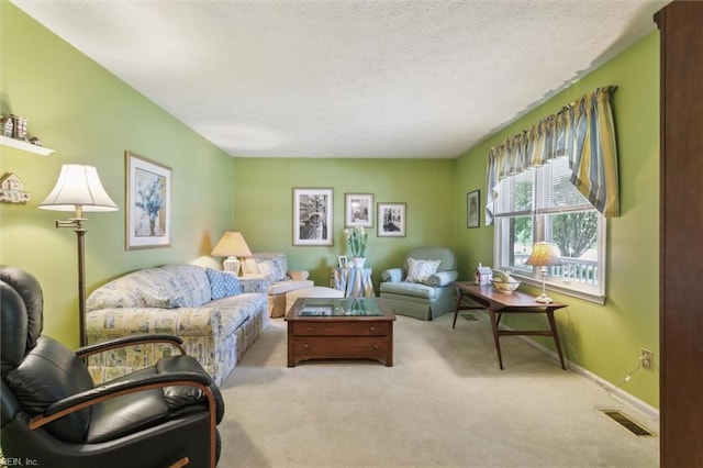 16 Windy Point Dr, Poquoson, VA 23662 - living room featuring carpet floors, a textured ceiling, and baseboards