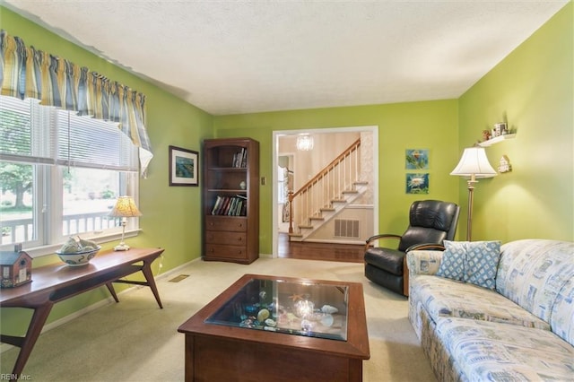 16 Windy Point Dr, Poquoson, VA 23662 - living area featuring carpet flooring, stairs, and baseboards