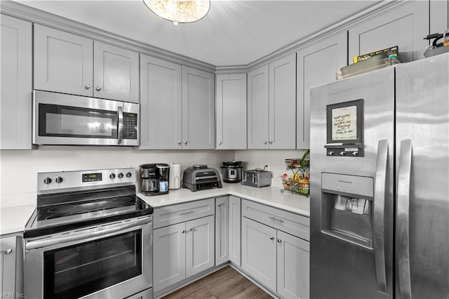 3701 Edinburgh Dr, Virginia Beach, VA 23452 - kitchen with appliances with stainless steel finishes, gray cabinetry, light countertops, and light wood-type flooring