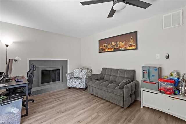 3701 Edinburgh Dr, Virginia Beach, VA 23452 - living area with wood finished floors, a ceiling fan, and a fireplace