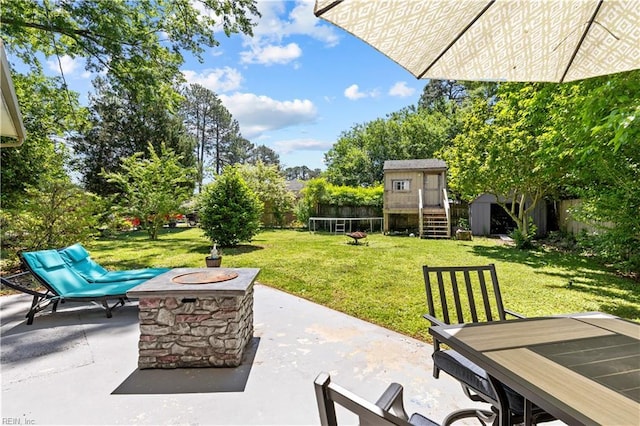 3701 Edinburgh Dr, Virginia Beach, VA 23452 - view of patio / terrace featuring a storage unit, an outdoor structure, and an outdoor fire pit