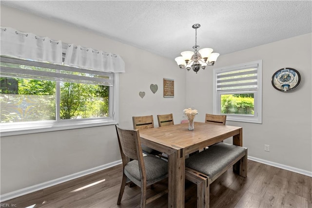 3701 Edinburgh Dr, Virginia Beach, VA 23452 - dining area featuring a chandelier, wood finished floors, baseboards, and a textured ceiling