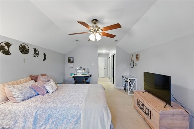 bedroom featuring lofted ceiling, light carpet, and a ceiling fan