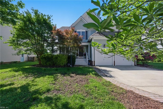 obstructed view of property featuring driveway, a garage, and a front yard