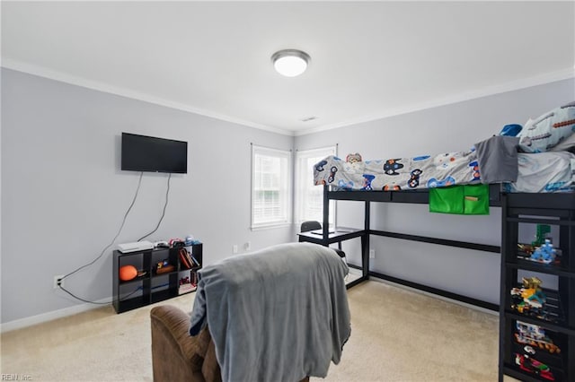 bedroom with carpet, ornamental molding, and baseboards
