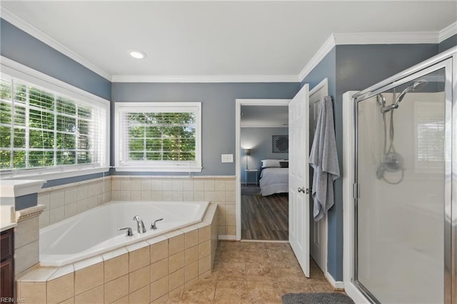 ensuite bathroom featuring a garden tub, a stall shower, vanity, ornamental molding, and tile patterned flooring
