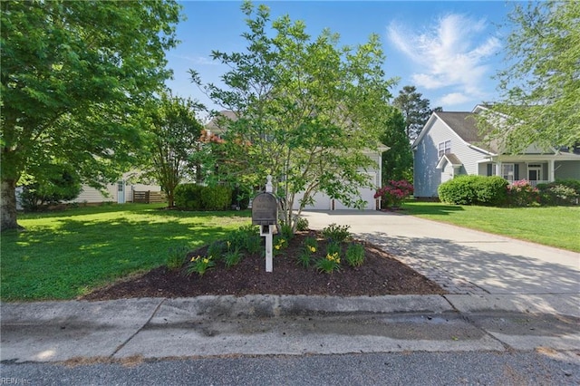 obstructed view of property featuring concrete driveway, a front lawn, and a garage