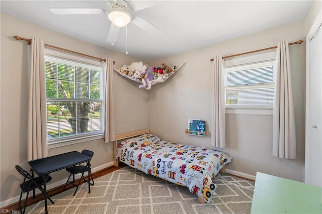 bedroom with baseboards and ceiling fan