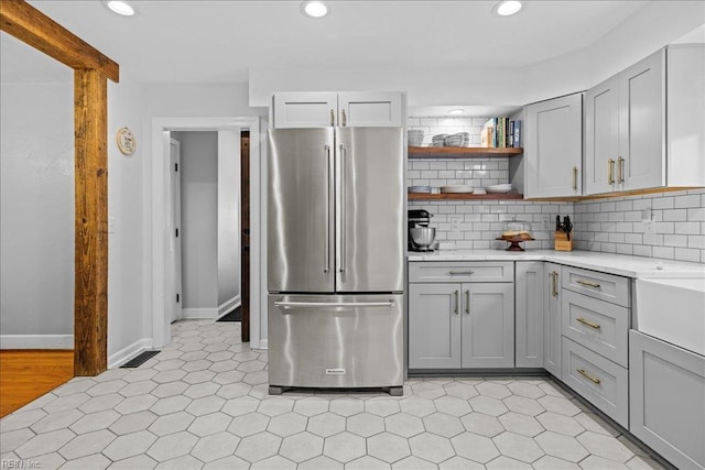 1126 Larchmont Cres, Norfolk, VA 23508 - kitchen featuring freestanding refrigerator, gray cabinetry, recessed lighting, decorative backsplash, and open shelves