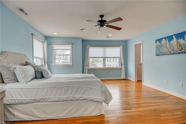 bedroom with light wood finished floors, baseboards, recessed lighting, and ceiling fan