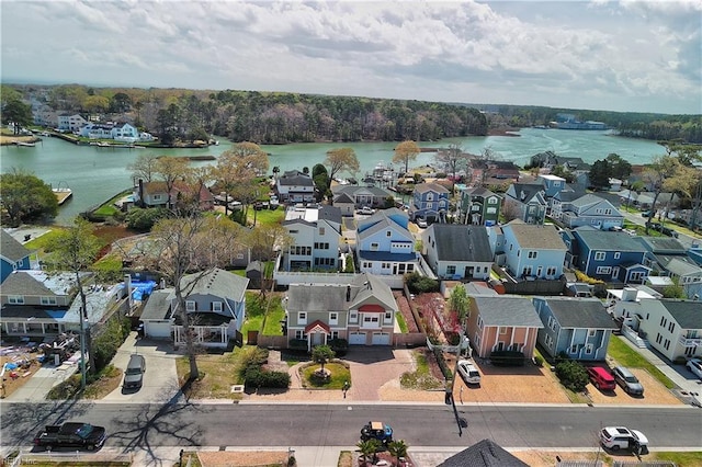 aerial perspective of suburban area with a large body of water