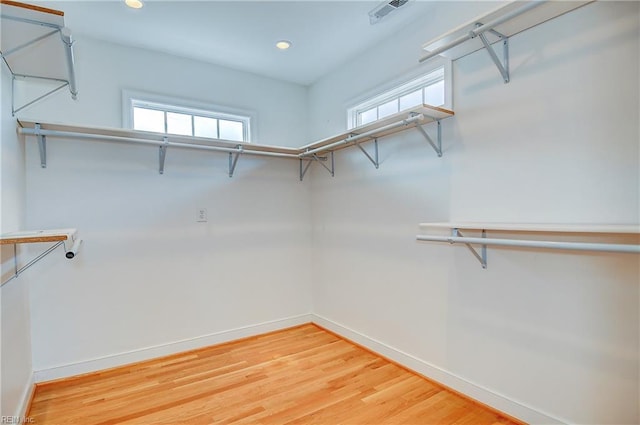 spacious closet featuring light wood-type flooring
