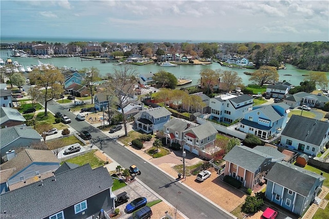 aerial perspective of suburban area featuring a large body of water