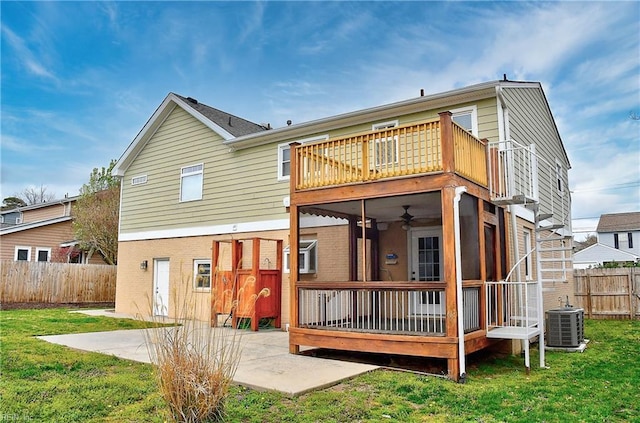 back of property featuring central air condition unit, a patio, a balcony, a ceiling fan, and a deck