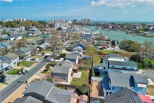aerial view of residential area featuring a nearby body of water