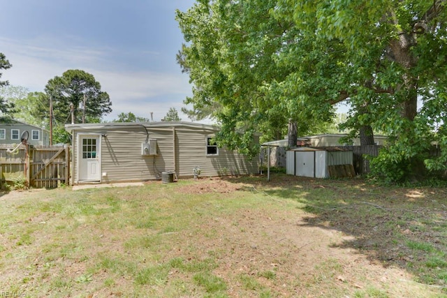 903 Bethel Rd, Chesapeake, VA 23324 - view of yard featuring a storage shed, an outbuilding, and central AC