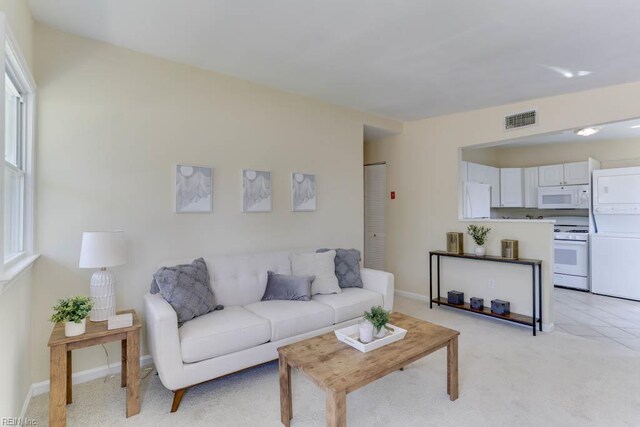 903 Bethel Rd, Chesapeake, VA 23324 - living area with baseboards and light colored carpet